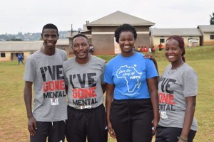 Eddy Ssenkaali (far left) is joined by Fields of Dreams Uganda staff members Jonathan Ssebambulide, Florence Ngamita, and Mercy Ajok to celebrate Eddy becoming a full-time staff member.