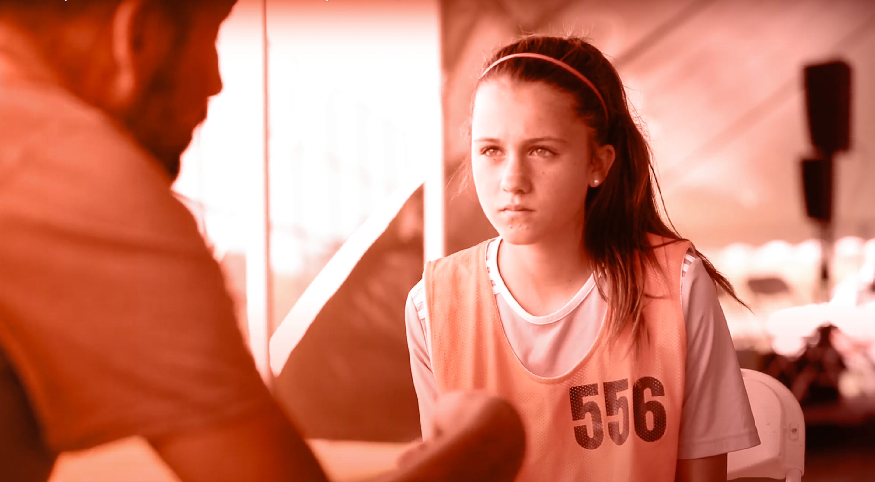 A Young Soccer Athlete Receives A One On One Evaluation At An EXACT College Showcase Camp